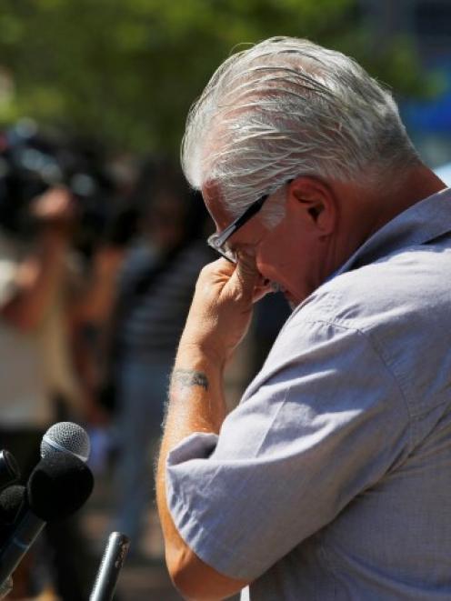 Steve Davis, brother of alleged James 'Whitey' Bulger victim Debra Davis, pauses while he speaks...