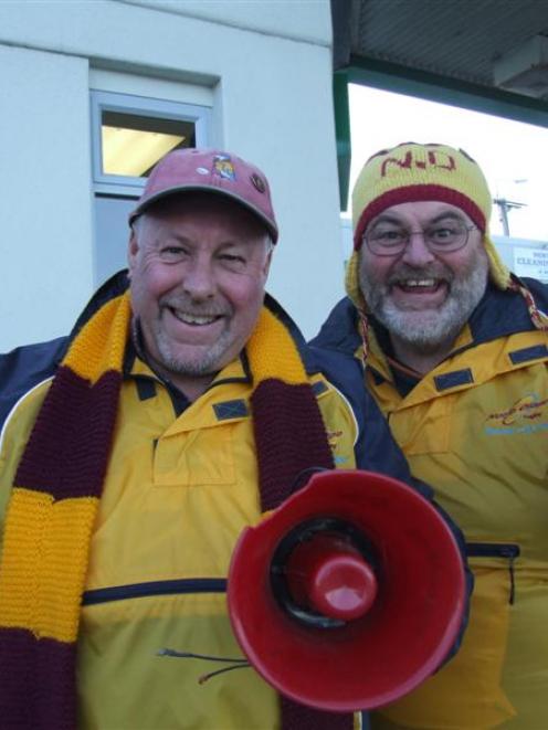 Steve (left) and Chris Rawson practise their cheering and horn-blowing in preparation for North...