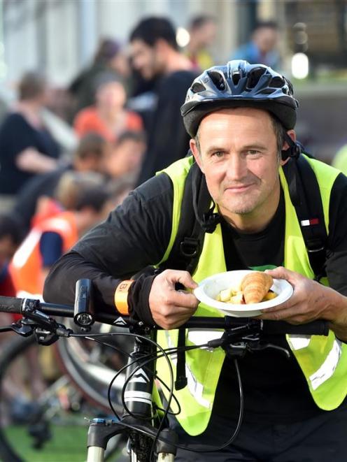 Steve Walker, of Port Chalmers, enjoys a free breakfast in the Octagon yesterday. PHOTO: PETER...