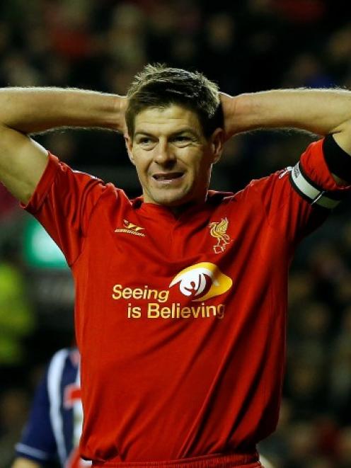 Steven Gerrard reacts after missing an opportunity for Liverpool against West Bromwich Albion in...