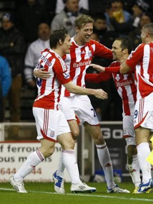 Stoke City's Matthew Etherington, second right, celebrates with teammates after scoring against...