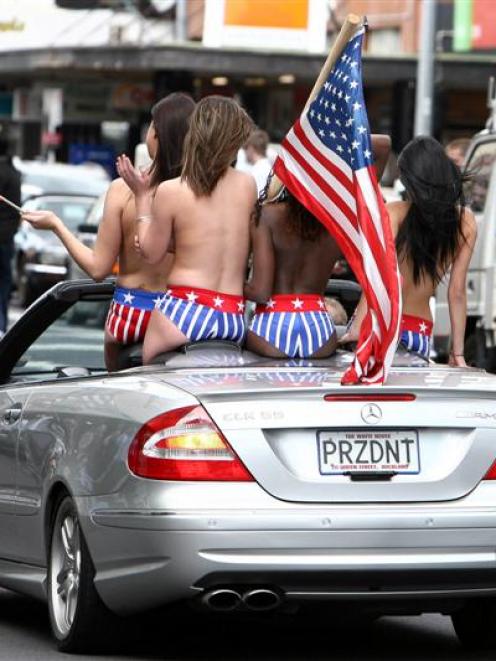 Strippers and pornstars parade down Queen St during the Boobs on Bikes parade. Photo by NZPA.