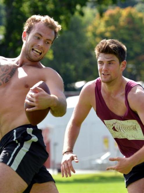 Students Callum Mulligan (19, left) and Simon Roberts (20), both of Christchurch, play a game of...