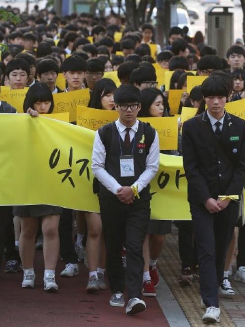 Students march during a recent rally in Ansan in memory of victims of the ferry sinking. REUTERS...