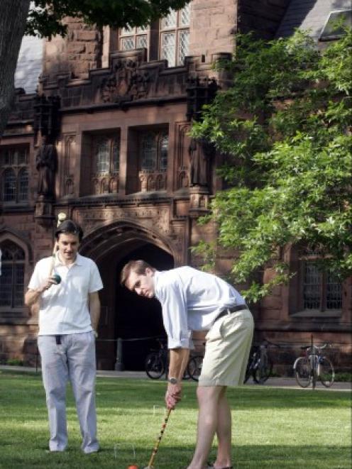 Students play croquet on the campus of Princeton University, which has been ranked as the top...