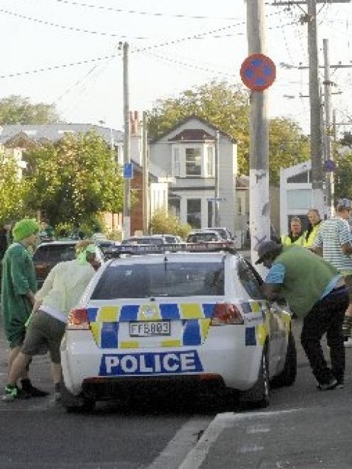 Students talk to Dunedin police after a brawl in Hyde St involving up to 50 people last night....