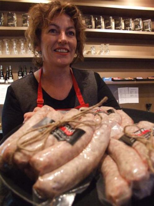 Sue Morton with Waitaki Bacon and Ham's rustic pork sausage, which is a finalist in the retail...