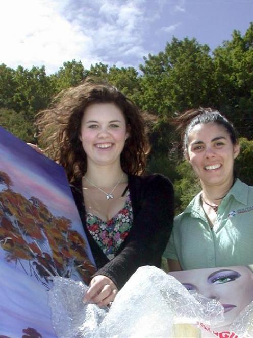 Summer Forgie (left) and Waitaki Resource Exchange co-ordinator Maxine Woodhouse use discarded...