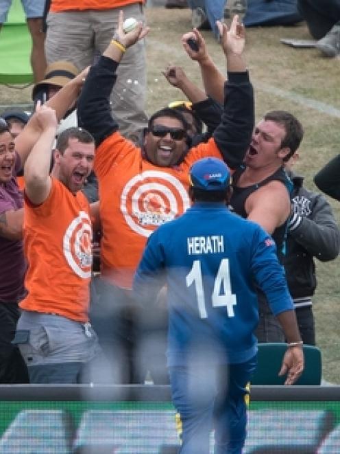 Sunjay Ganda celebrates catching a six at Hagley Oval in the opening game of the World Cup. Photo...