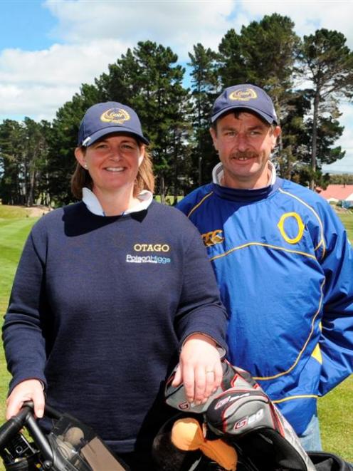 Susan Greig and her husband and caddy Danny are all smiles after her resounding 10 and 8 win over...