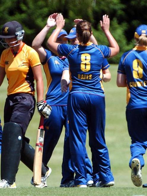 Suzie Bates' team-mates congratulate Bates after her dismissal of Wellington Blaze opener Anne...