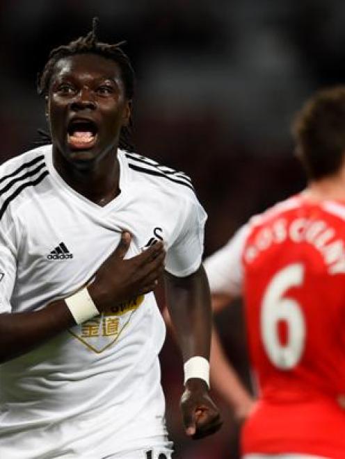 Swansea's Bafetimbi Gomis celebrates scoring against Arsenal. Photo: Reuters