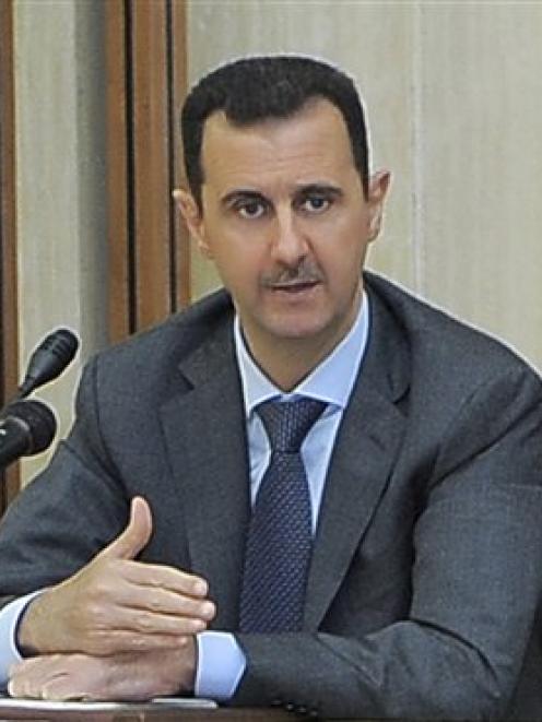 Syrian President Bashar Assad addresses a meeting for the central committee of the Baath party in...