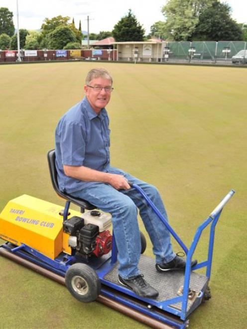 Taieri Bowling Club manager and green keeper Rob Gibson prepares the green to host the national...