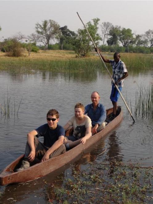 Taieri College pupils (from left) Sam Kirk and Christine Cleave  are led through the Okavango...