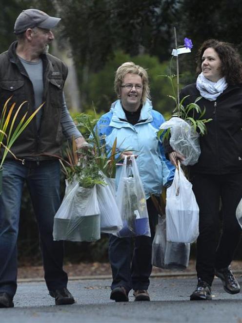 Taking away their purchases from Saturday's Friends of the Dunedin Botanic Garden plant sale  are...