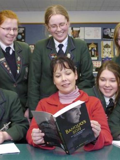 Tania Roxborogh (centre) with a copy of Banquo's Son and her Columba College advisers (front from...