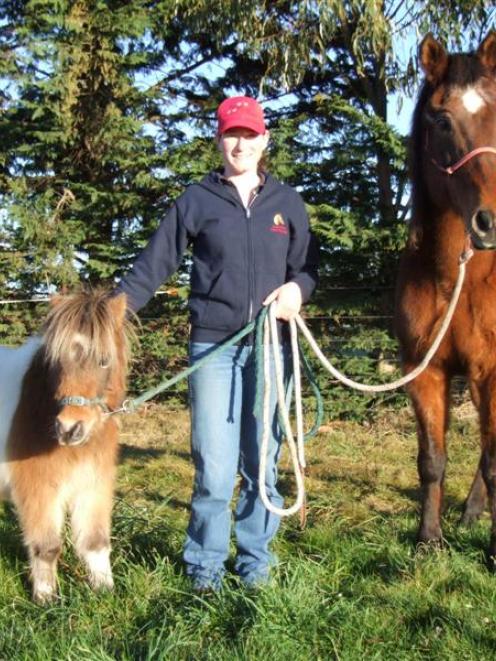 Tara McConnell at home at Flag Swamp with Laddie and Trixie. Photo by Sally Rae.