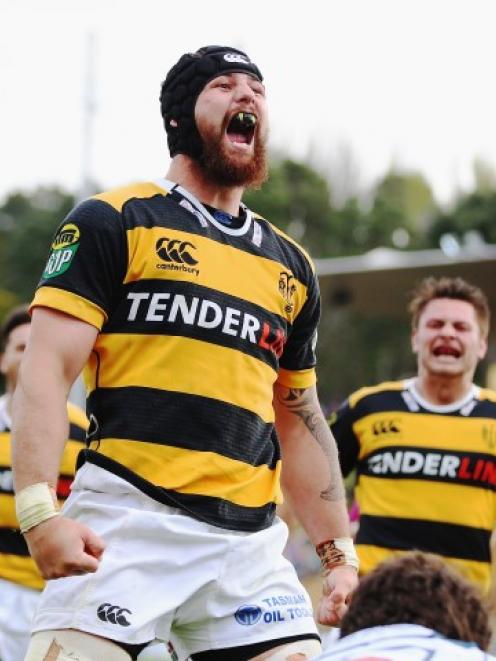 Taranaki's Blade Thomson celebrates after scoring a try against Auckland at Yarrow Stadium in New...