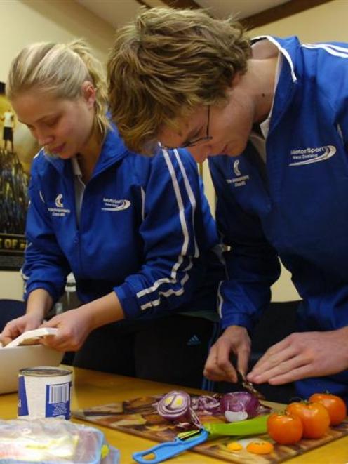 Tarryn Cox (21) and Matthew Summerfield (19) learn to cook nutritious meals at the Academy of...
