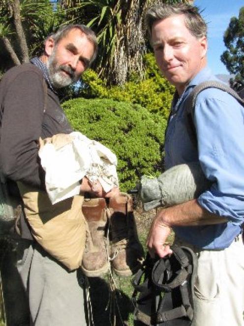 Te Araroa Trail Otago trustee Gilbert van Reenen (left) weighed down by  his 1960s tramping kit,...