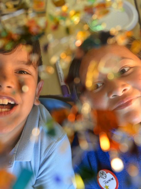 Te Kura Kaupapa Maori o Otepoti pupils Tumai Campbell (7) and Jazmine Tau (9) inspect recycled...