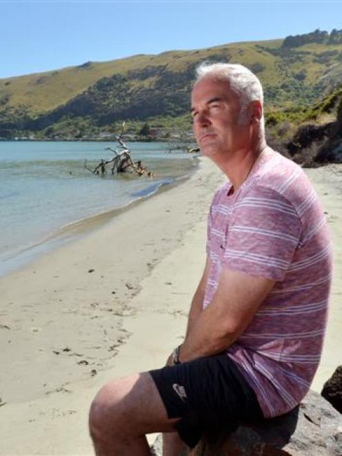 Te Rauone Coastal Care Group chairman Hoani Langsbury on Te Raone Beach which is crumbling into...