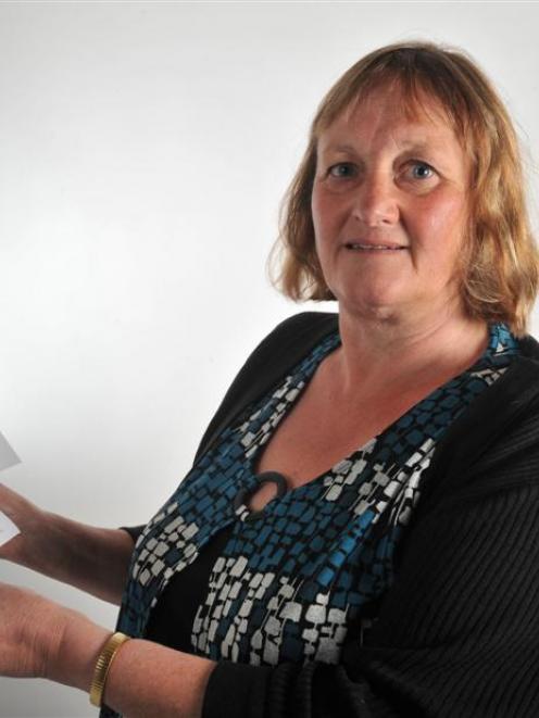 Teacher Ruth Baldwin holds a pamphlet she has written to raise awareness about the Alpine Fault...