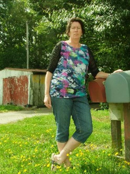 Teacher Sarah Roberts outside her family farm. Photo by Chris Morris.