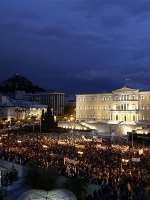 Teachers and supporters gather in front of the Greek Parliament this week  during a rally against...