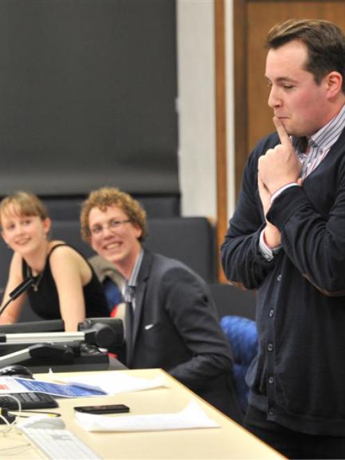 Team members Grace Jansen (left) and Joe Ascroft (centre) look on.