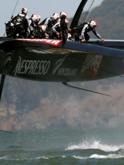 Team New Zealand narowly avoided a capsize while racing against Oracle yesterday. Photo Reuters