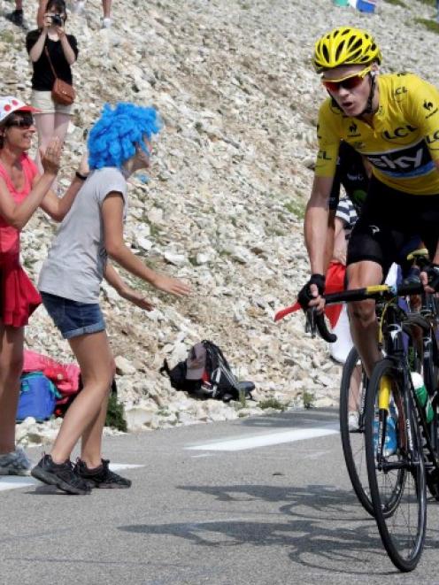 Team Sky rider Christopher Froome of Britain climbs the Mont Ventoux during the 242.5km 15th...