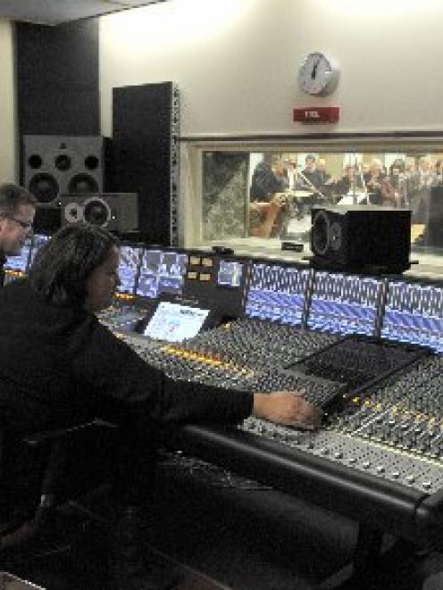 Technicians Stephen Stedman and Lou Kewene at the controls of the Solid State Logic C200HD mixing...
