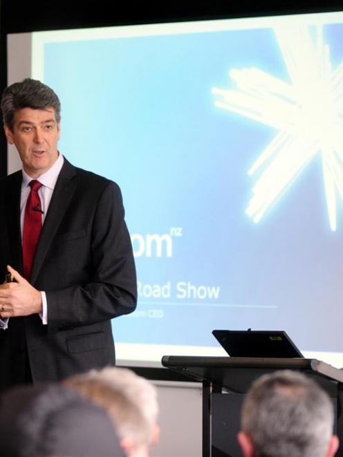 Telecom chief executive Paul Reynolds composes a reply to a Dunedin shareholder's question...