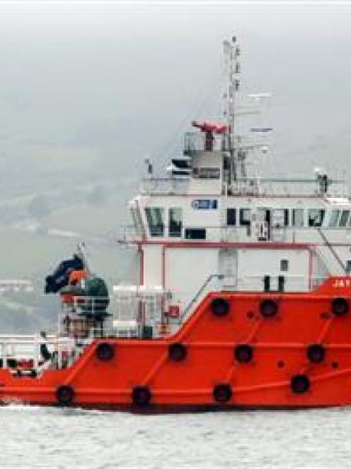 Tender supply vessel Jaya Amazon dwarfs tourist boat Monarch on Otago Harbour yesterday, ahead of...