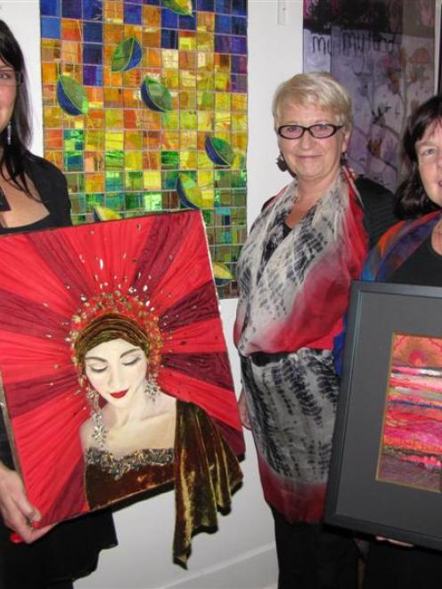 Textile artist Karyn Hitchman, of Queenstown, (left) holds her best local art award-winning work,...