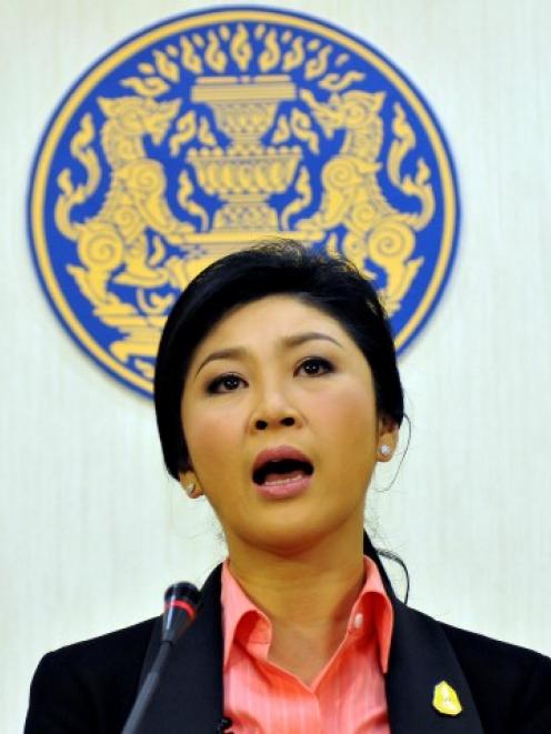 Thai Prime Minister Yingluck Shinawatra talks during a news conference at police headquarters in...