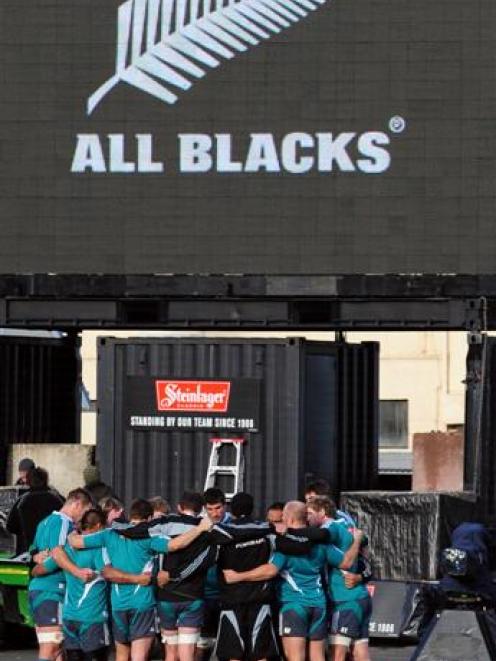 The All Blacks go into a huddle during the captain's run at Carisbrook yesterday. Photo by Craig...