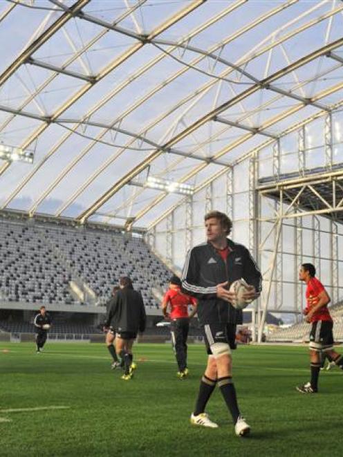 The All Blacks, including Otago's Adam Thomson (with the ball), train at Forsyth Barr Stadium in...