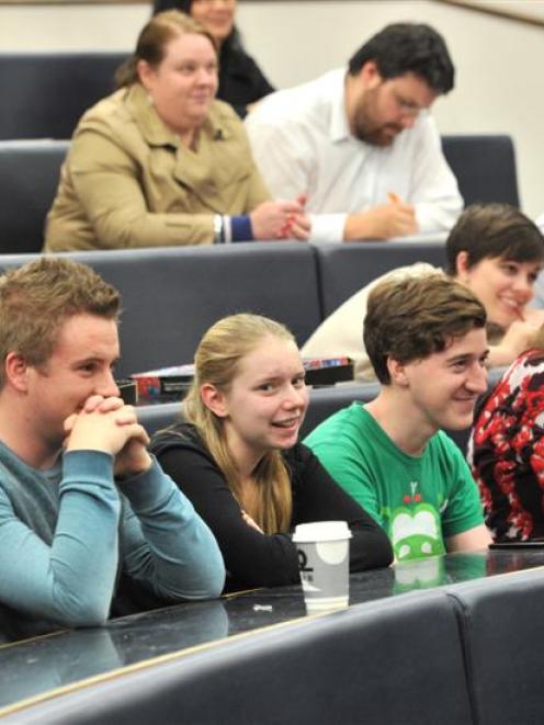 The audience waits as student debater John Brinsley-Pirie considers his response as he argues...