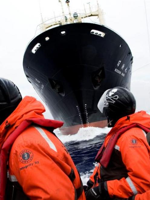 The bow of whaling boat Nisshin Maru as seen from an inflatable Sea Shepherd anti-whaling boat...