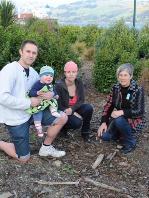 The Burden family look at the site where a pohutukawa tree they planted for baby Cooper has been...