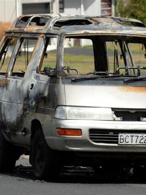The burnt out shell of a van which was set alight at Luke St, Ocean Grove, early yesterday. Photo...
