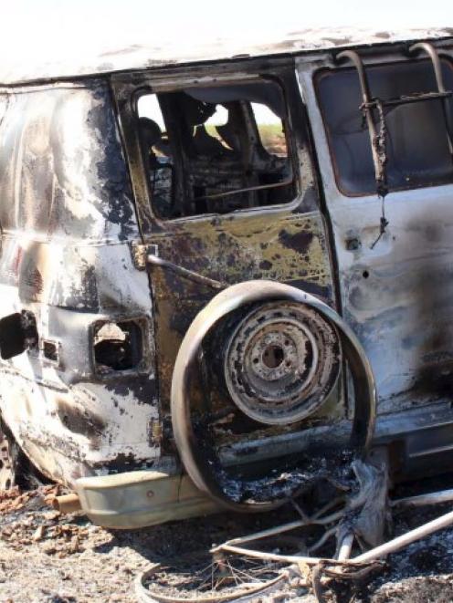 The burnt-out van that belonged to the missing men. REUTERS/ Noroeste.com/ Carlos Chaidez