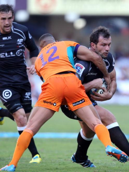 The Cheetahs' Rayno Benjamin tackles Sharks captain Bismarck du Plessis. Photo Getty Images