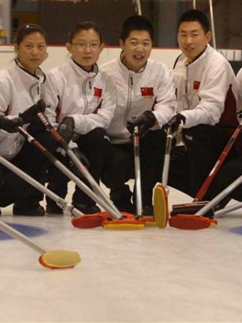 The Chinese curling team (from left) are Liu Jinli, Zhou Yan, Yue Qingshuang, Liu Yin, Wang Binyu...