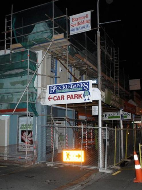 The closed and scaffolded building in South Dunedin last night. Photo by Linda Robertson.