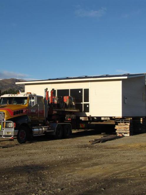 The Clutha Valley Presbyterian Church sits in Buchanan Transport's yard in Cromwell, almost a...