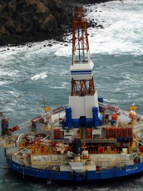 The conical drilling unit Kulluk sits grounded 64km southwest of Kodiak City, Alaska earlier this...